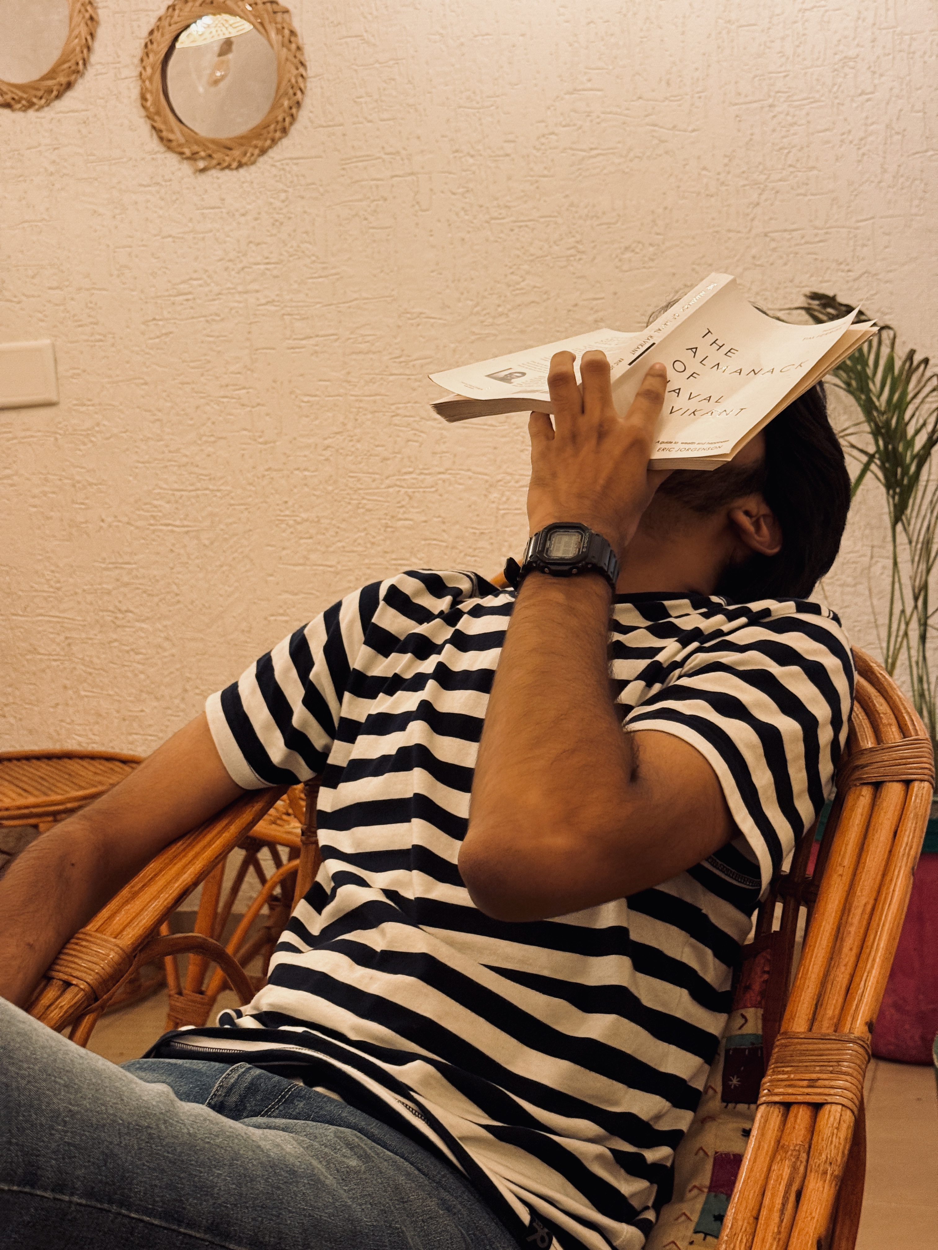 Het's face covered with a book
